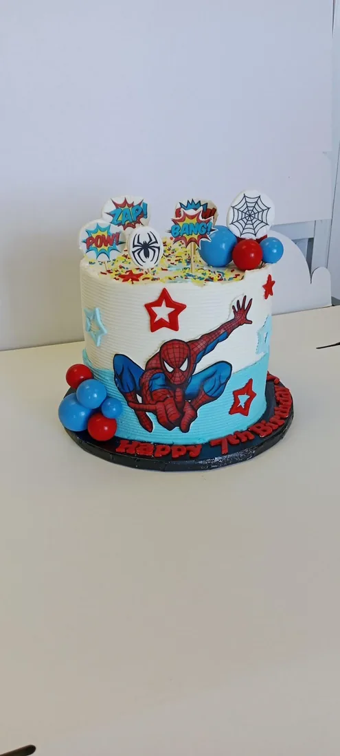 Superhero themed celebration cake