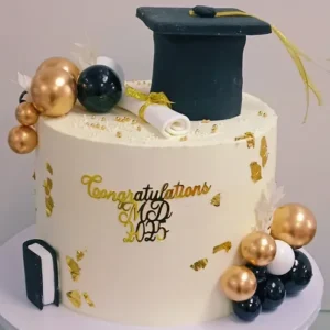 Navy Cap and Gold Balloon Graduation Cake